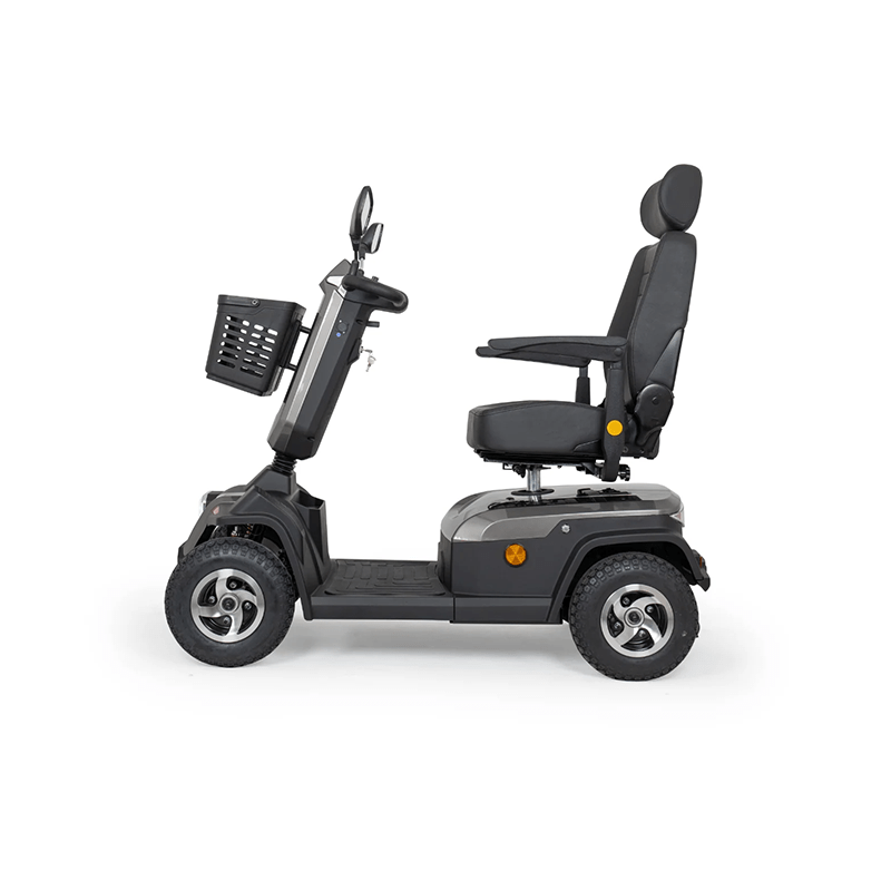 Scooterpac Savvy 8 Plus - Black mobility scooter with a basket on a white background