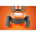 Savvy 8 - Close-up of an orange lawn mower on an orange background